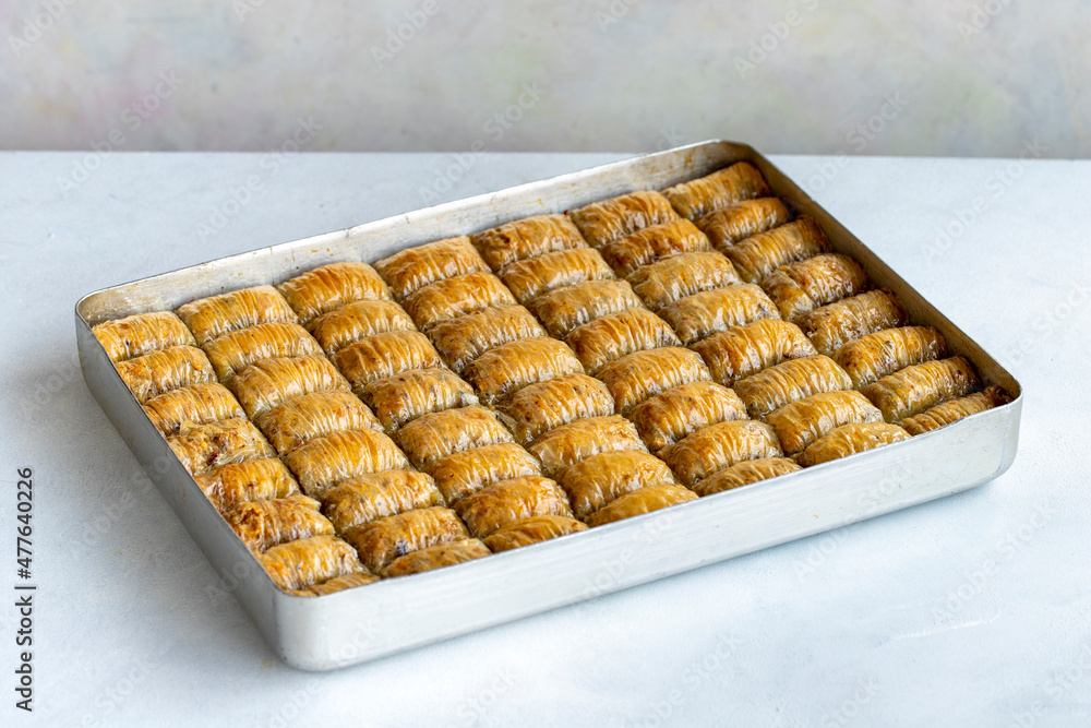 Walnut tray baklava on a white background. Horizontal view. Turkish cuisine flavor baklava Walnut tray baklava on a white background. Horizontal view. Turkish cuisine flavor baklava
