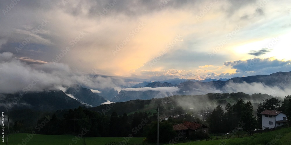Scenic view of Forest and mountains against misty and foggy sky in South Tyrol, Bozen, Italy