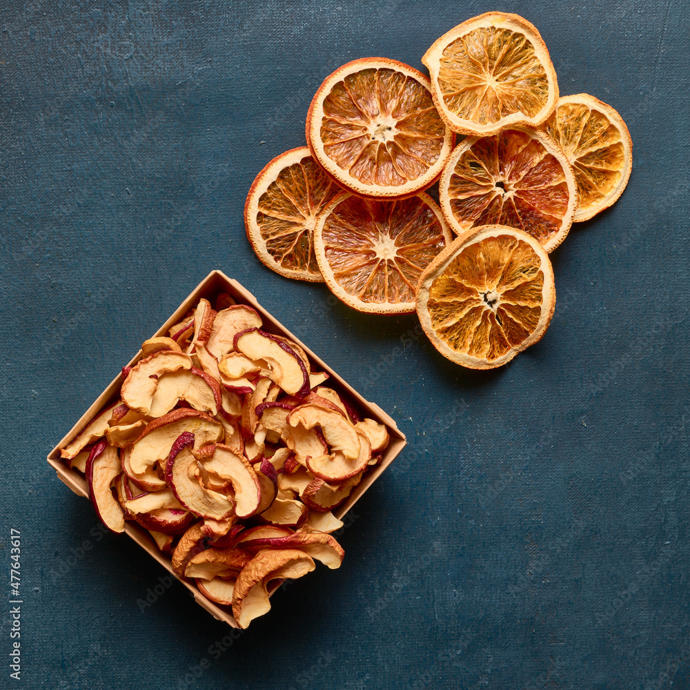 Dried apple and orange slices close up, healthy food concept
