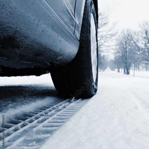 Car tire track in the snow. Concept for transport and winter tires in winter time. © montypeter