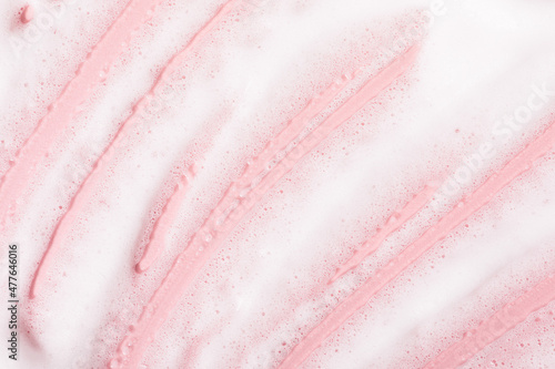Canvas Print White bubble foam smudged on pink surface