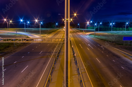 night empty road with illuminated lanterns