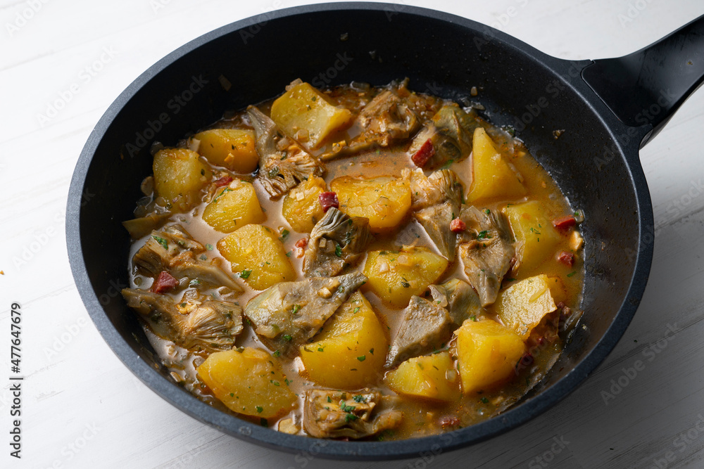 Soup with artichokes, ham and potatoes. Traditional Spanish tapa. Soup with artichokes, ham and potatoes. Traditional Spanish tapa.