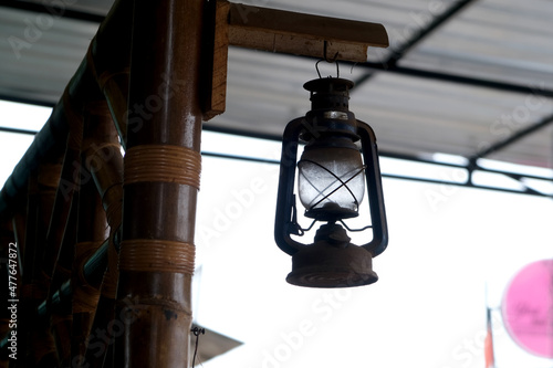 Old lantern lamp hanging in front of the house photo