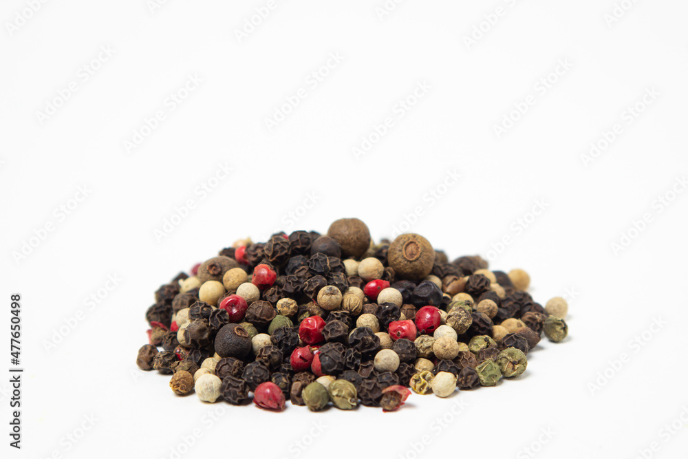 Mix of peppers on a white background. Peppers mix isolated. Peppercorns Mix of peppers on a white background. Peppers mix isolated. Peppercorns