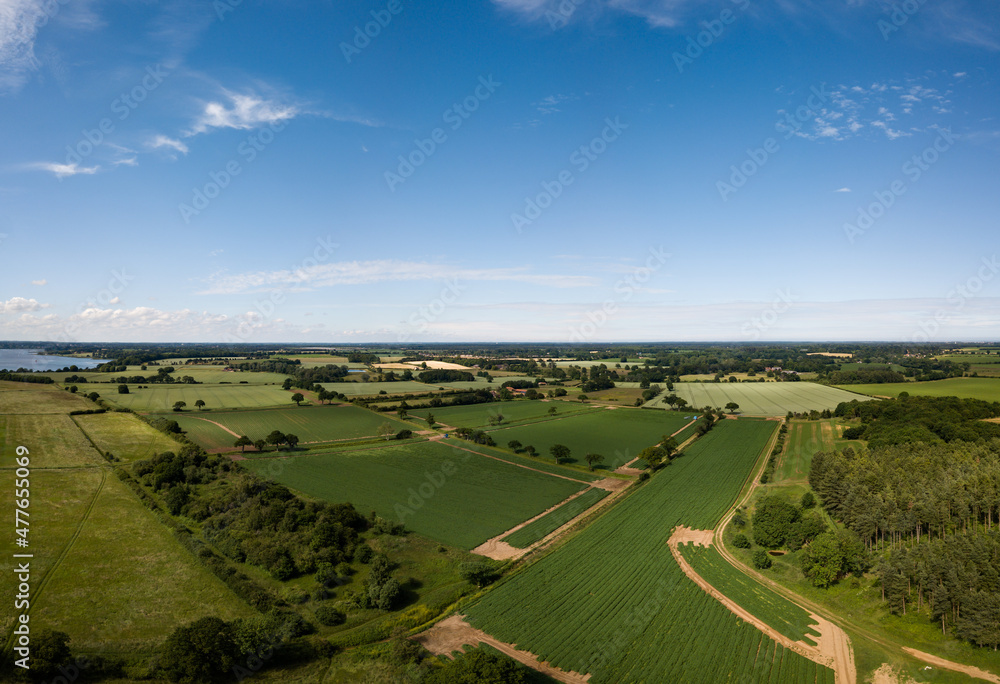 Aerial view of a patchwork of farm fields in the Suffolk countryside