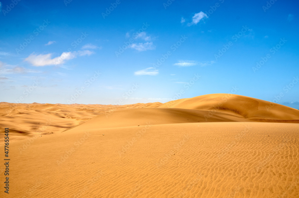 Namib desert dark yellow against a blue sky, good for backgrounds