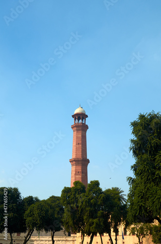 Old minaret against blue sky in Pakistan
