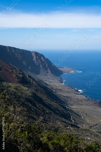 Panoramic with mountainside and sea. Canary Islands lava coast photo