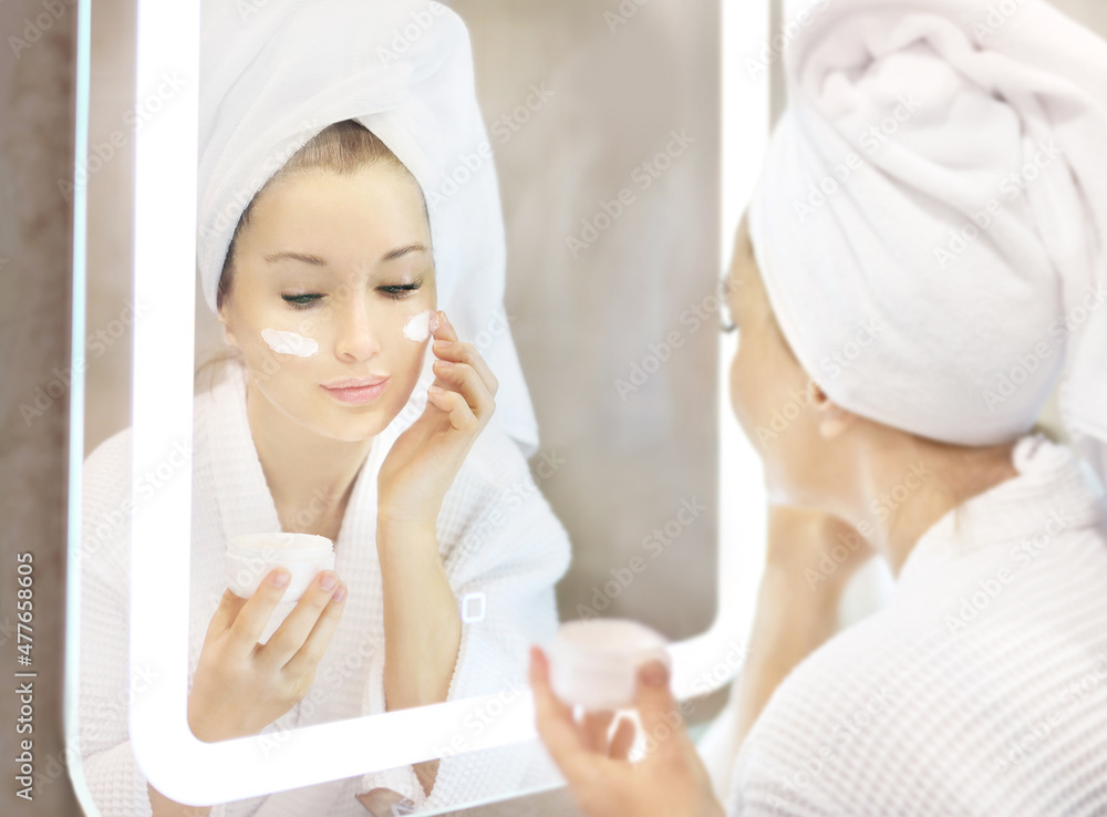 Magic anti-aging cream.Applying the cream. Magic anti-aging cream.Applying the cream.
