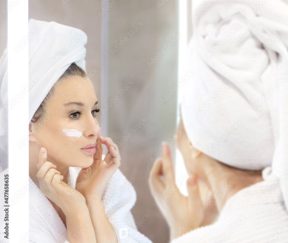 Magic anti-aging cream.Applying the cream. Magic anti-aging cream.Applying the cream.