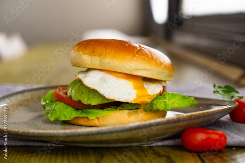 Egg and Avocado Bun Sandwich. English breakfast.