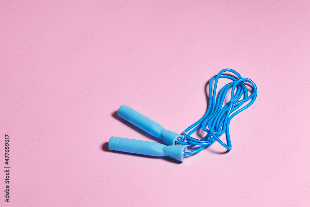 Blue Jump Rope Or Skipping Rope On A Pink Background Sports Fitness Workout Concept Stock 写真 Adobe Stock