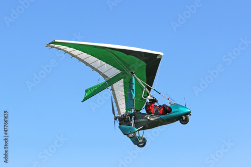 Valokuva Ultralight airplane flying in a blue sky