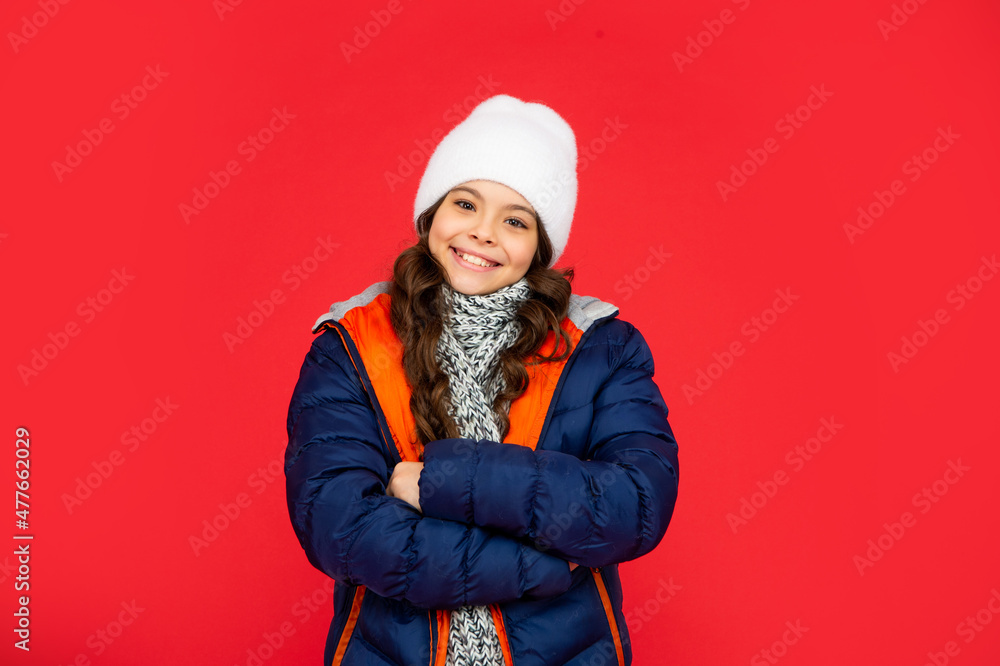 portrait of child wearing warm clothes with scarf. express positive emotion. winter fashion. portrait of child wearing warm clothes with scarf. express positive emotion. winter fashion.