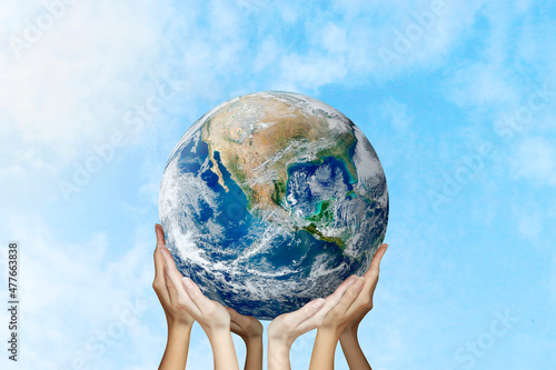 Hands hold planet earth. Concept of society, responsibility. Earth Day. Mother Nature. Global. Ecology of the world. Control of pollution of the planet. Elements of the image provided by NASA.
