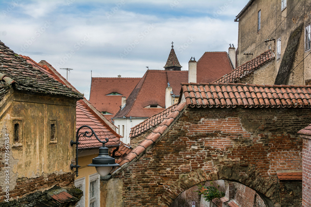 Roofs of the houses of the city of Sibiu in Romania. Attic windows.