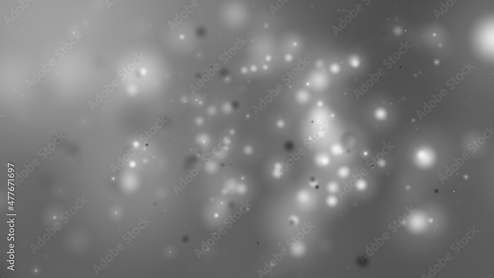 灰色の空間に浮遊するたくさんの光る粒子