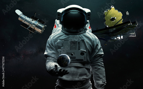 Fototapeta Naklejka Na Ścianę i Meble -  Astronaut and two telescopes James Webb and Hubble. JWST launch art. Elements of image provided by Nasa