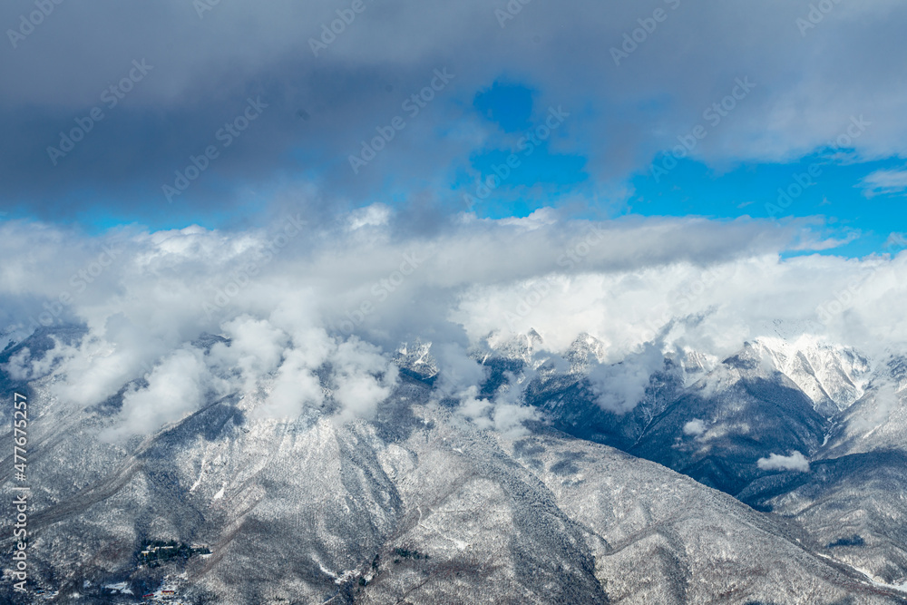 mountains with white snow and blue sky mountains with white snow and blue sky
