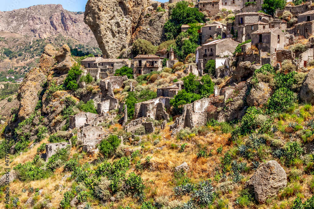 Small village of Pentedattilo, church and ruins of the abandoned village, Greek colony on Mount Calvario, whose form recalls the five fingers. Calabria, Italy Small village of Pentedattilo, church and ruins of the abandoned village, Greek colony on Mount Calvario, whose form recalls the five fingers. Calabria, Italy