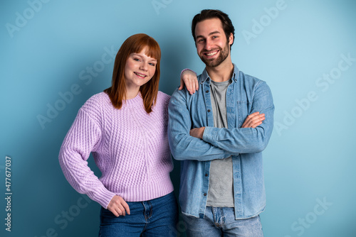 Cheerful young caucasian couple standing together and bonding to each other © speed300