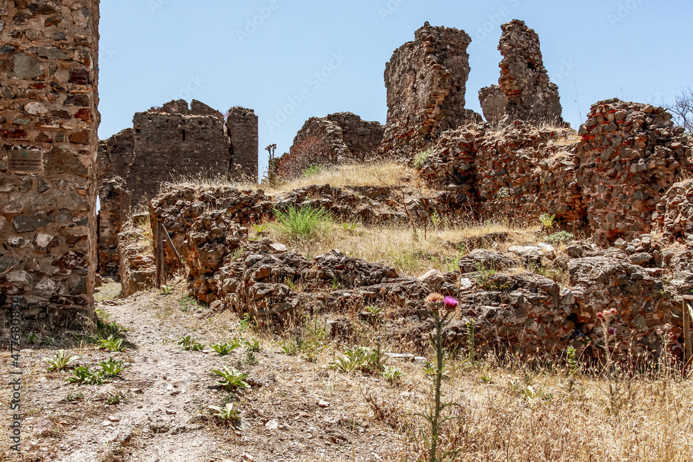 The ruins of the castle Castello Ruffo. Ruin of a Ghost Town in National Park Aspromonte with the Fiumara (river) of Amendolea, Calabria, Italy