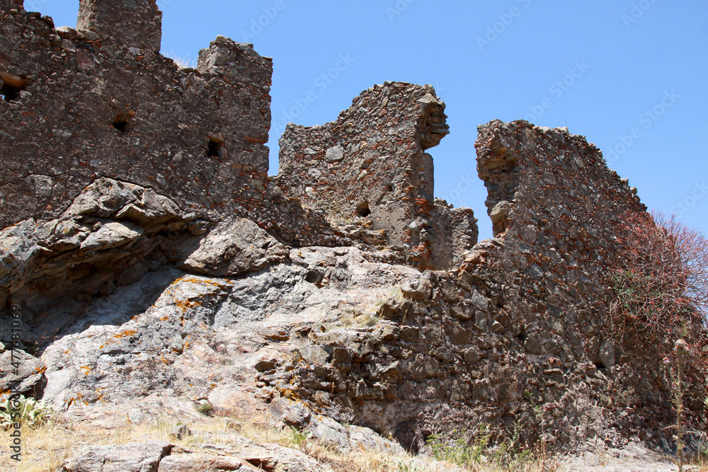 The ruins of the castle Castello Ruffo. Ruin of a Ghost Town in National Park Aspromonte with the Fiumara (river) of Amendolea, Calabria, Italy