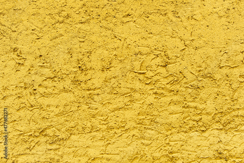 Rough version of Yellow plaster. Textured wall background