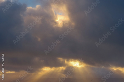 Beautiful cloudy sky with sun beams. Warm and cool color. Nature background