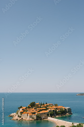 Sveti Stefan Island against a blue sky in the Bay of Kotor