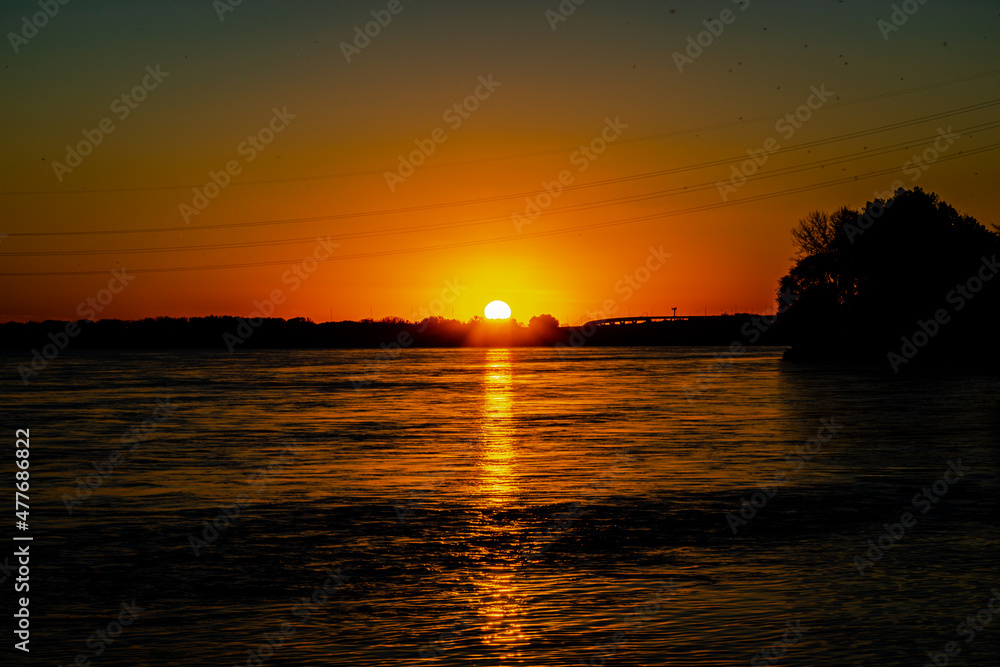 Sunrise and sunset on St. Lawrence river 