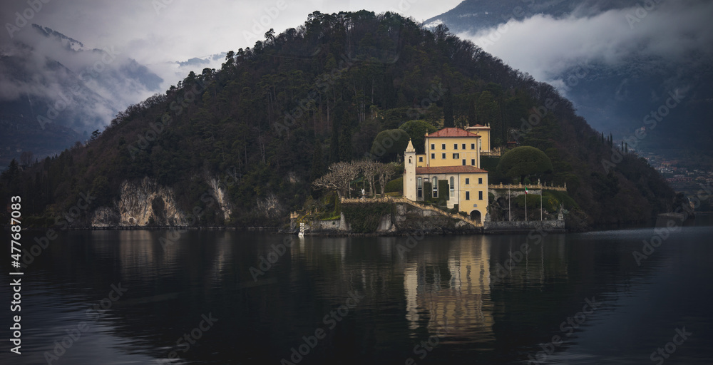 Vibrant buildings on the edge of the shore of Lake Como in Italy during the winter/spring months.