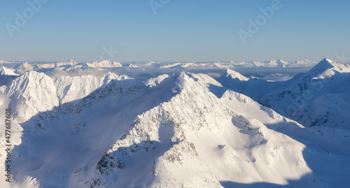 Aerial Panoramic View of Canadian Mountain covered in snow during sunny winter season. Located near Whistler, North of Vancouver, British Columbia, Canada. Nature Background Panorama