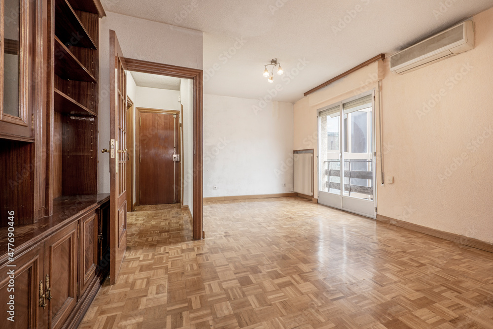 Room with window and dark mahogany wood furniture Room with window and dark mahogany wood furniture