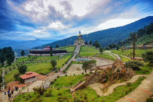 Beautiful huge statue of Lord Buddha, at Rabangla , Sikkim , India. Surrounded by Himalayan Mountains it is called Buddha Park - a popular tourist attraction. photo