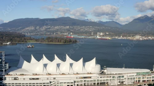 Panoramic View Of Canada Place Building And Burrard Inlet In Vancouver, Canada. - wide panning photo