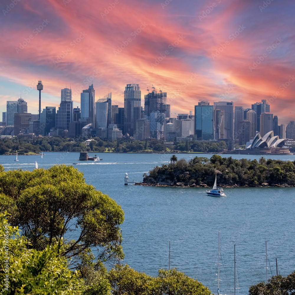 Obraz premium View of Sydney Harbour NSW Australia. Ferry boats partly cloudy colourful skies blue waters