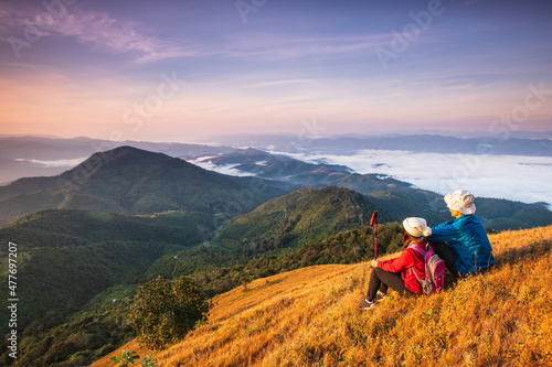 The lover hiking on high mountains and sea of mist . Doi Pui Ko, Mae Hong Son Province, Thailand.
