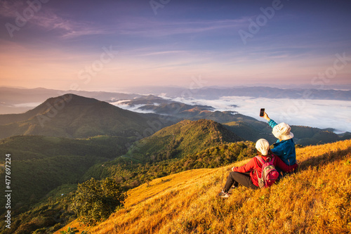 The lover hiking on high mountains and sea of mist . Doi Pui Ko,  Mae Hong Son Province, Thailand.