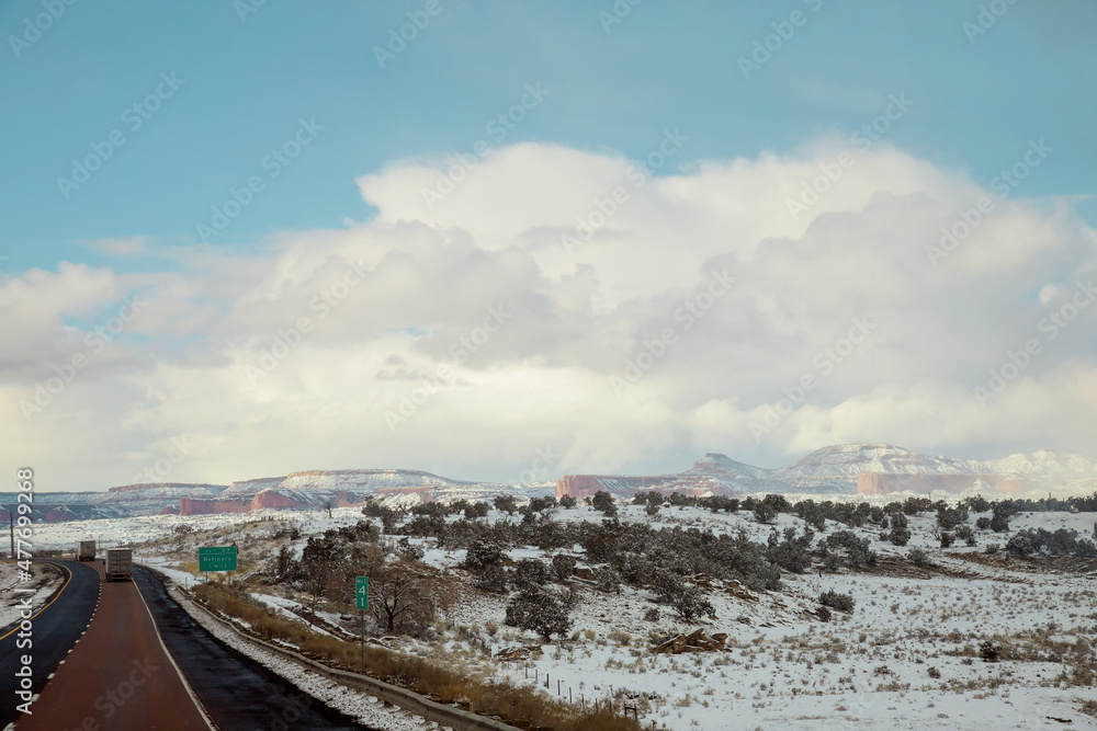 Winter landscape of desert mountain covered snow along the I-40 highway in New Mexico