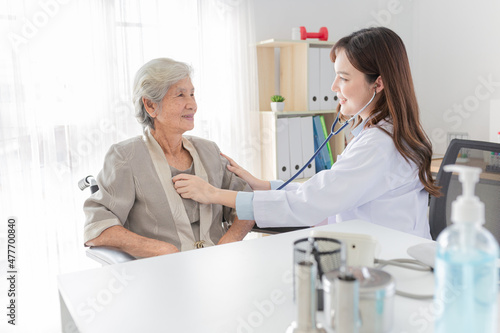 close up doctor, Asian doctor talk with old female patient about disease symptom, doctor use stethoscope listening lung of patient, elderly health check up, happiness hospital
