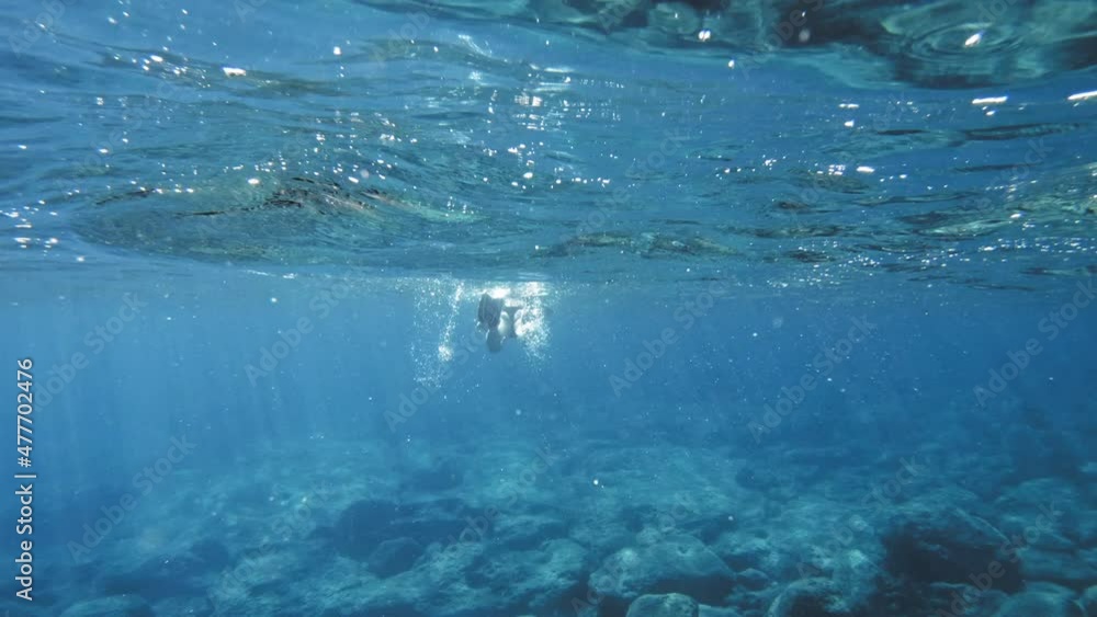Snorkeling In The Ionian Sea Of Kefalonia Islands In Greece. Underwater Shot Snorkeling In The Ionian Sea Of Kefalonia Islands In Greece. Underwater Shot