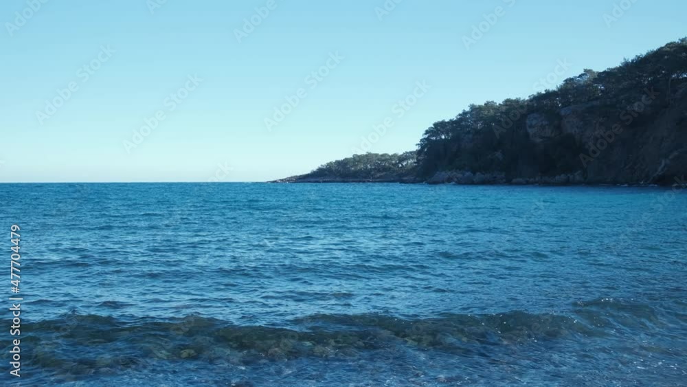Blues sea and small mountain. Landscape view of beach blue sea Blues sea and small mountain. Landscape view of beach blue sea