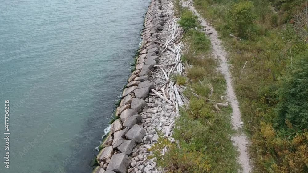 Lakefront Shoreline Trail Rock-wall Dead Tree Stumps Grass Hill Shrubs Lake Ontario Great Lakes Lakefront Shoreline Trail Rock-wall Dead Tree Stumps Grass Hill Shrubs Lake Ontario Great Lakes