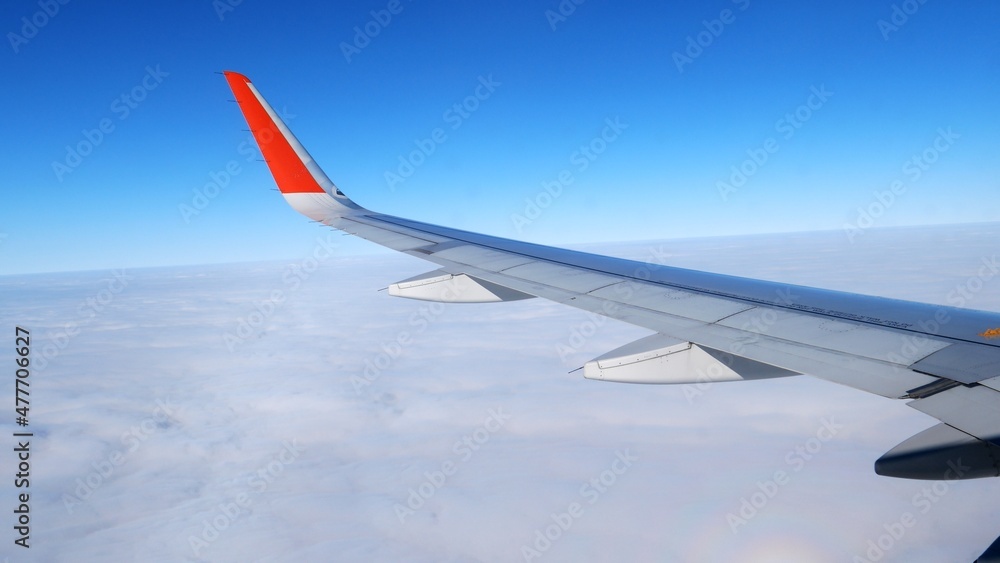 The plane flies through the cumulus clouds. Descent from blue skies into dramatic darkness. The plane flies through the cumulus clouds. Descent from blue skies into dramatic darkness.