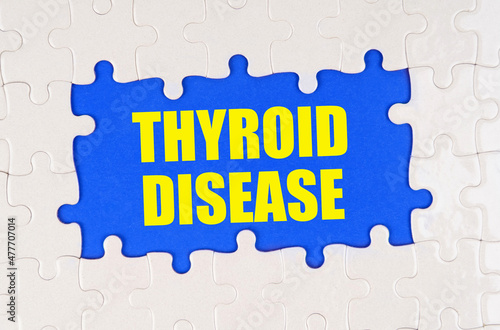 Inside the white puzzles on a blue background it is written - Thyroid Disease