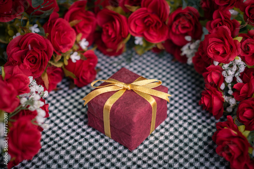 Romantic still life  Red roses on a silk white putty background. Fragrant red flowers  gift concept for Valentine s Day  Wedding or Birthday. Soft focus. any day to say I love you. red for Chinese new