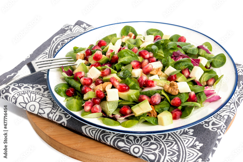 Vegetable vitamin salad with fresh young spinach leaves, mozzarella cheese, pomegranate seeds, avocado, walnuts and lemon juice. Vegetable vitamin salad with fresh young spinach leaves, mozzarella cheese, pomegranate seeds, avocado, walnuts and lemon juice.