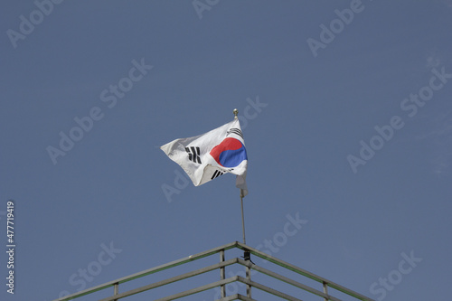 
Taegeukgi waving in the blue sky.